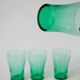 Set of 4 green glass glasses 1970
