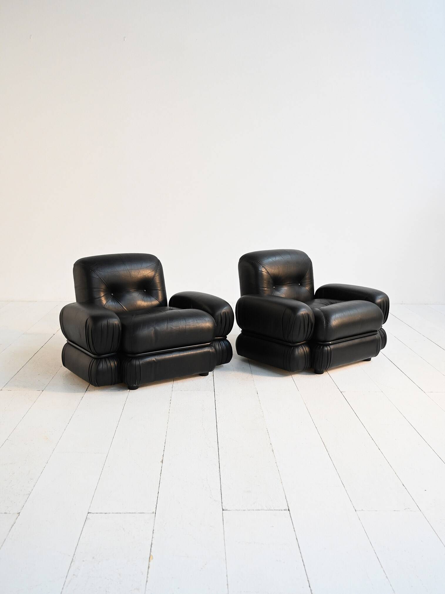 Black leather and tubular steel armchairs, 1970s