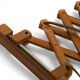 Solid teak wall lamp/Scissor lamp with brass coloured aluminium shade.