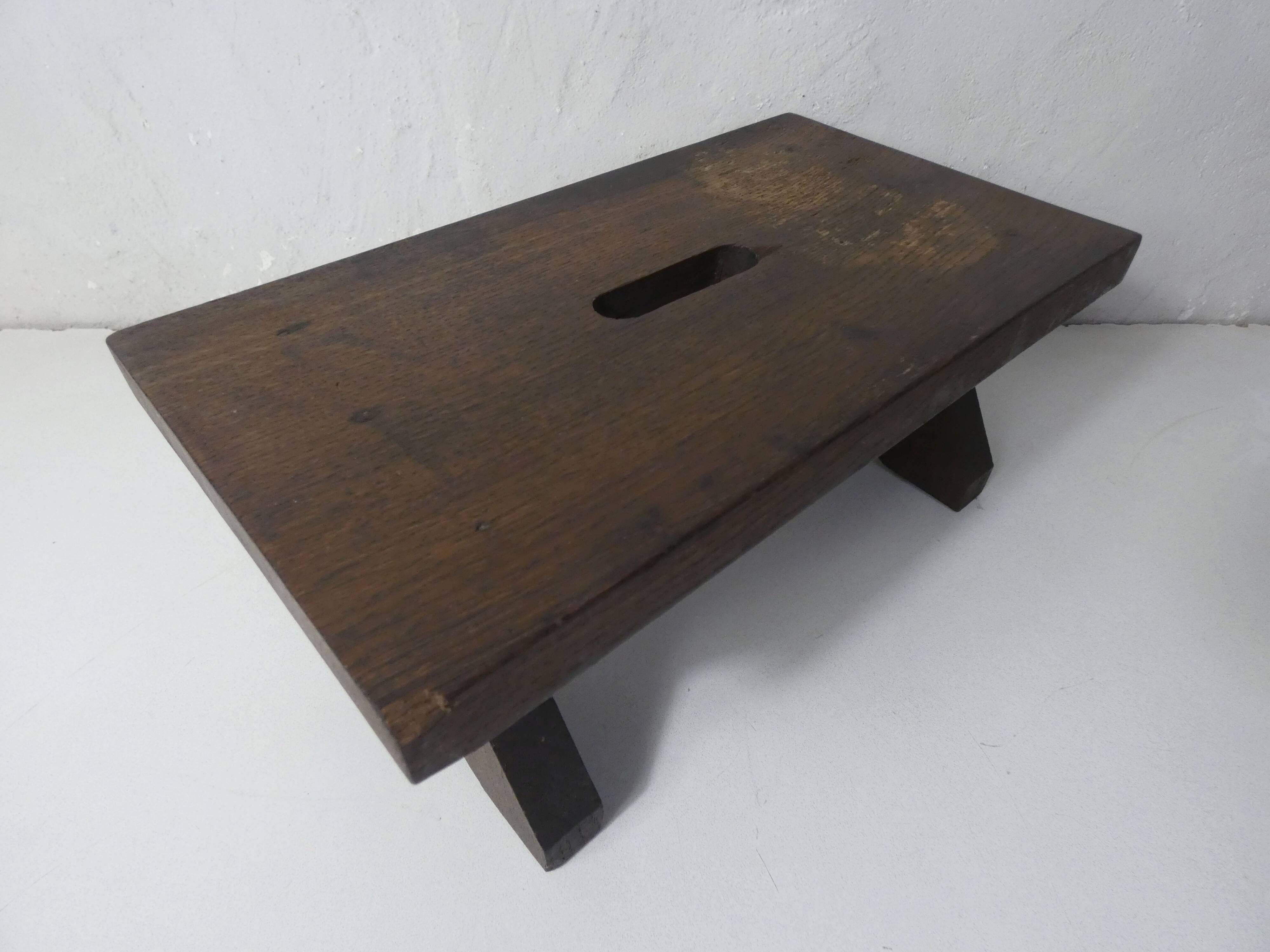 Old small wooden bench step in solid oak