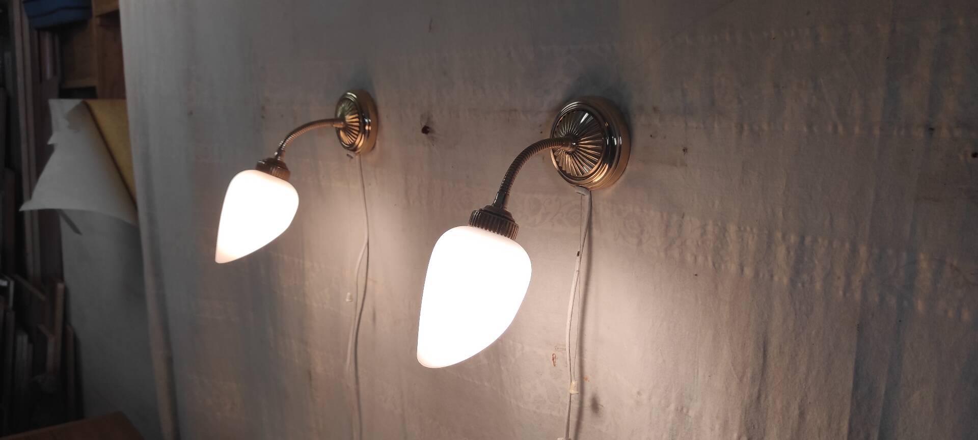 Articulated brass and opaline wall lights - mid 20th century.