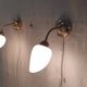 Articulated brass and opaline wall lights - mid 20th century.