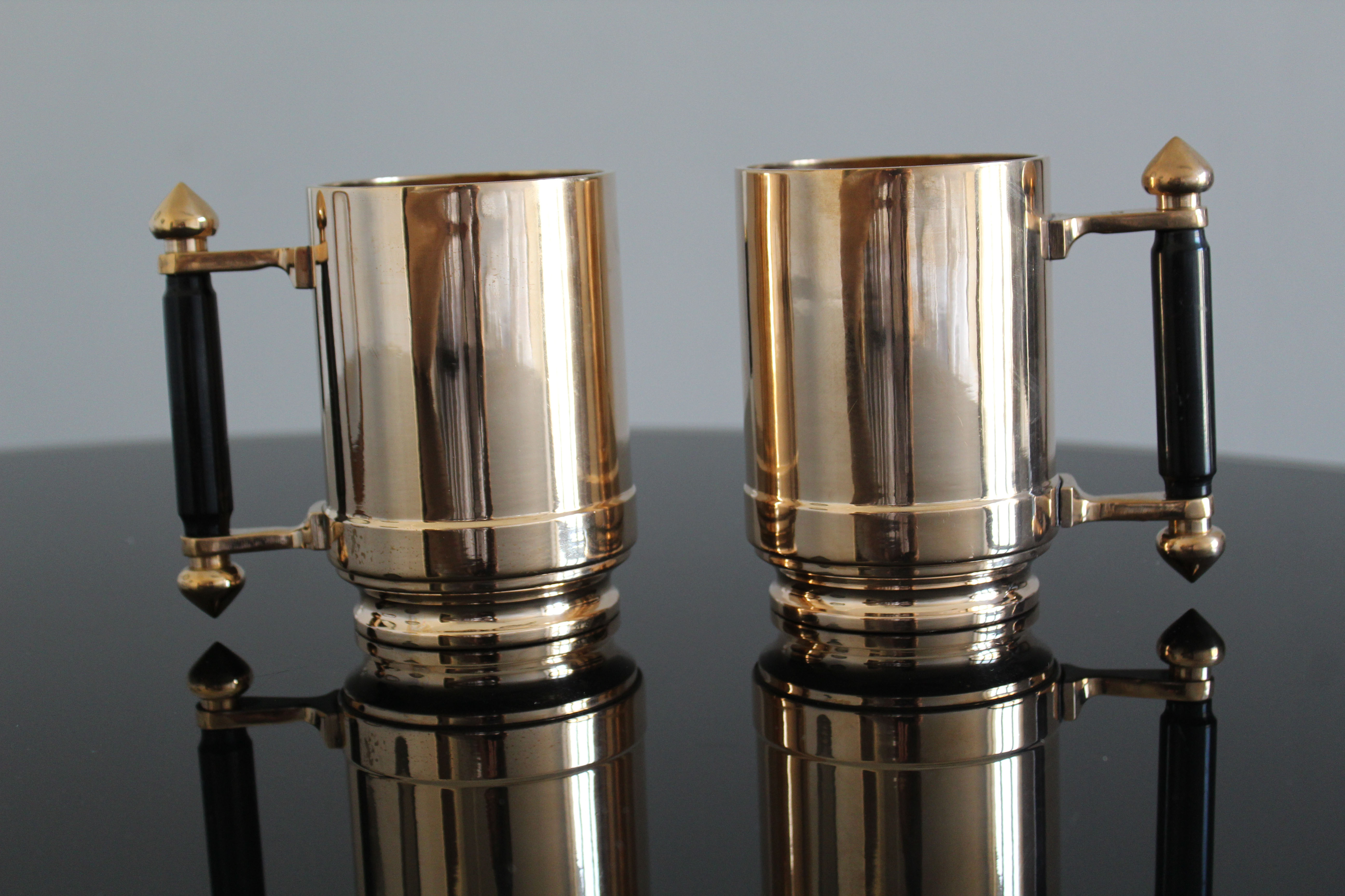 Pair of art deco bronze beer mugs France, 1940s, signed Bronze Star