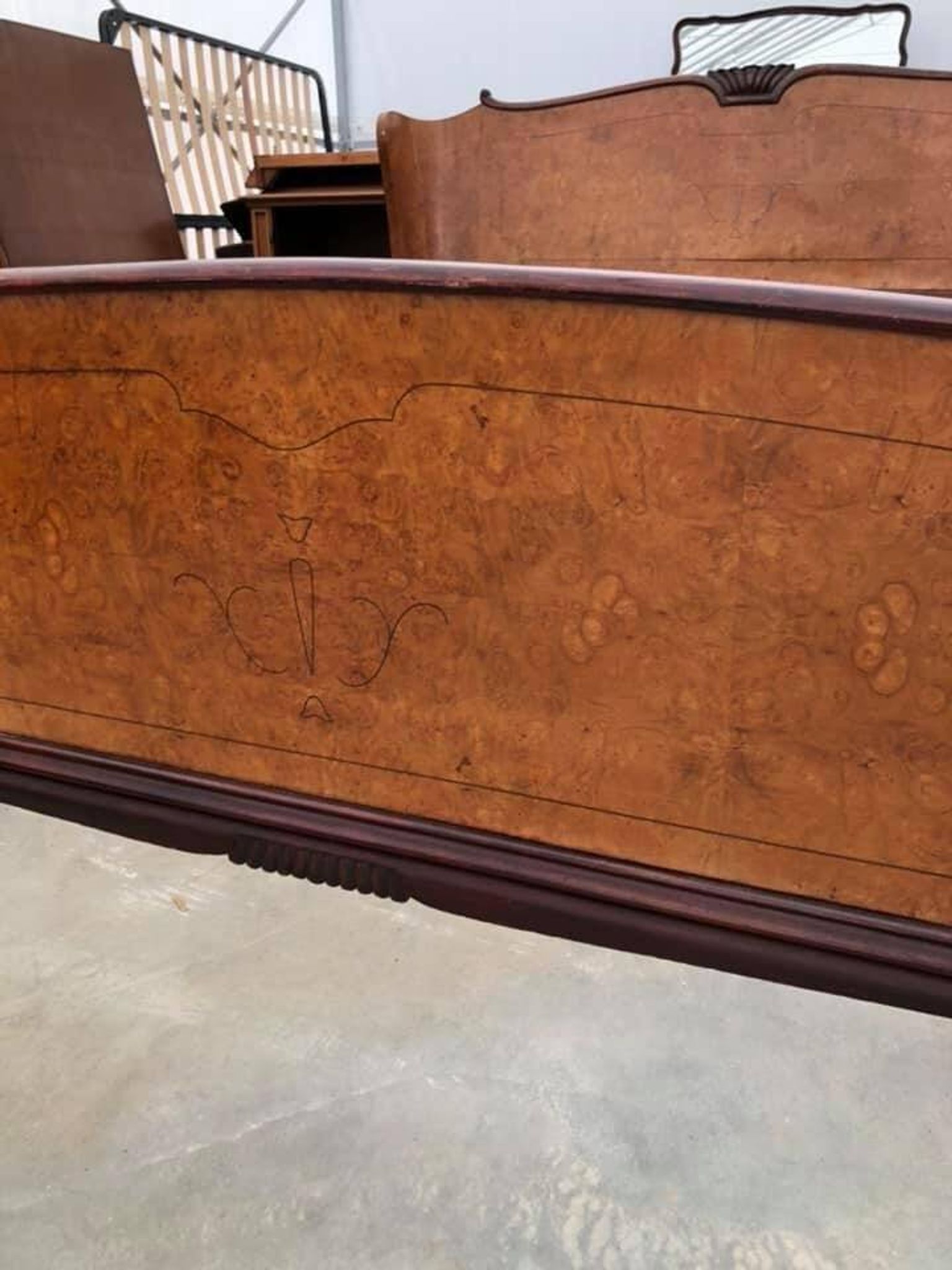 Brown lacquered wooden double bed frame in Mid-Century style from the 1940s.