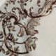 4 assiettes plates en terre de fer marron à décor d'oiseaux