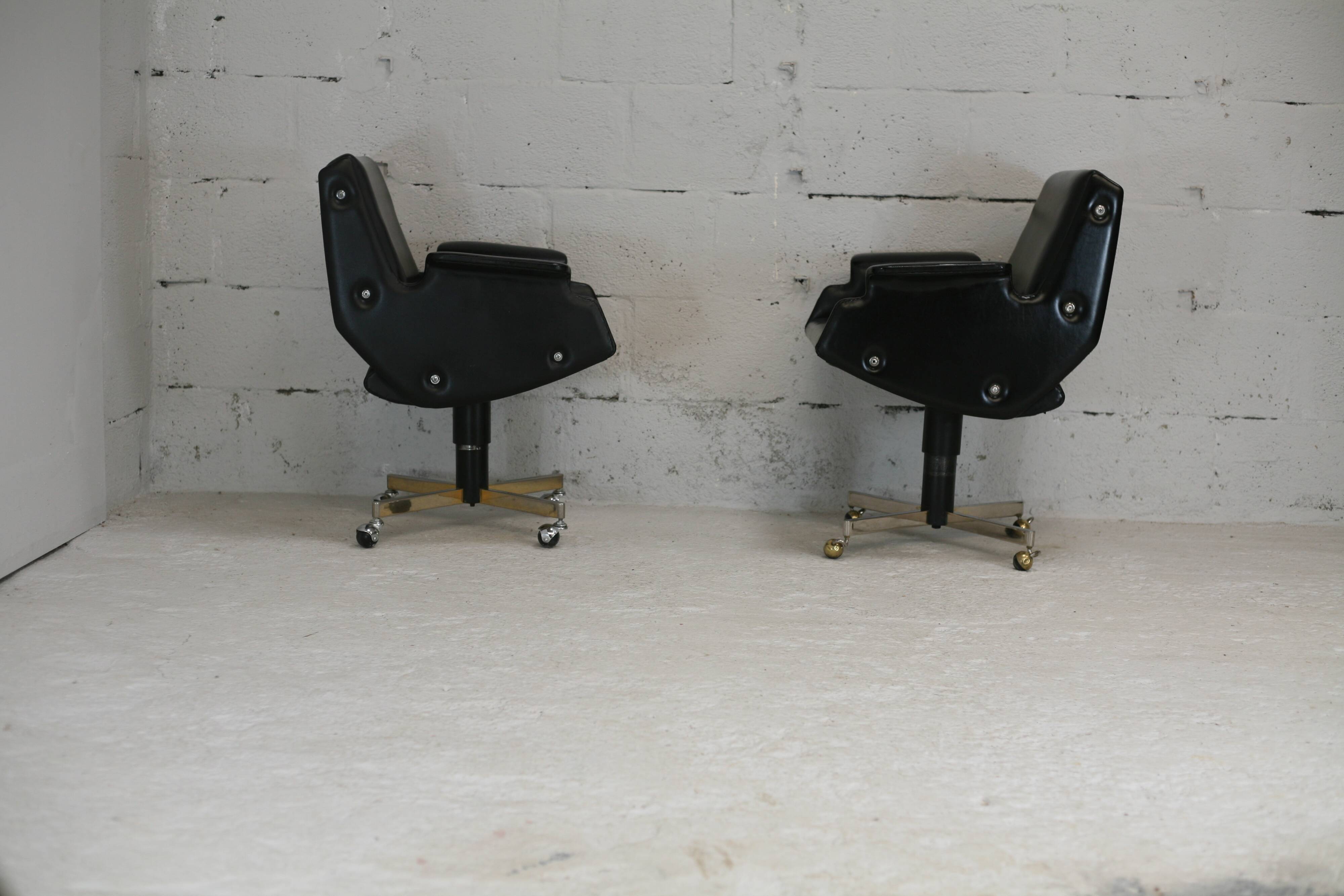 Pair of swivel armchairs, imitation leather and steel, Italy, circa 1960.