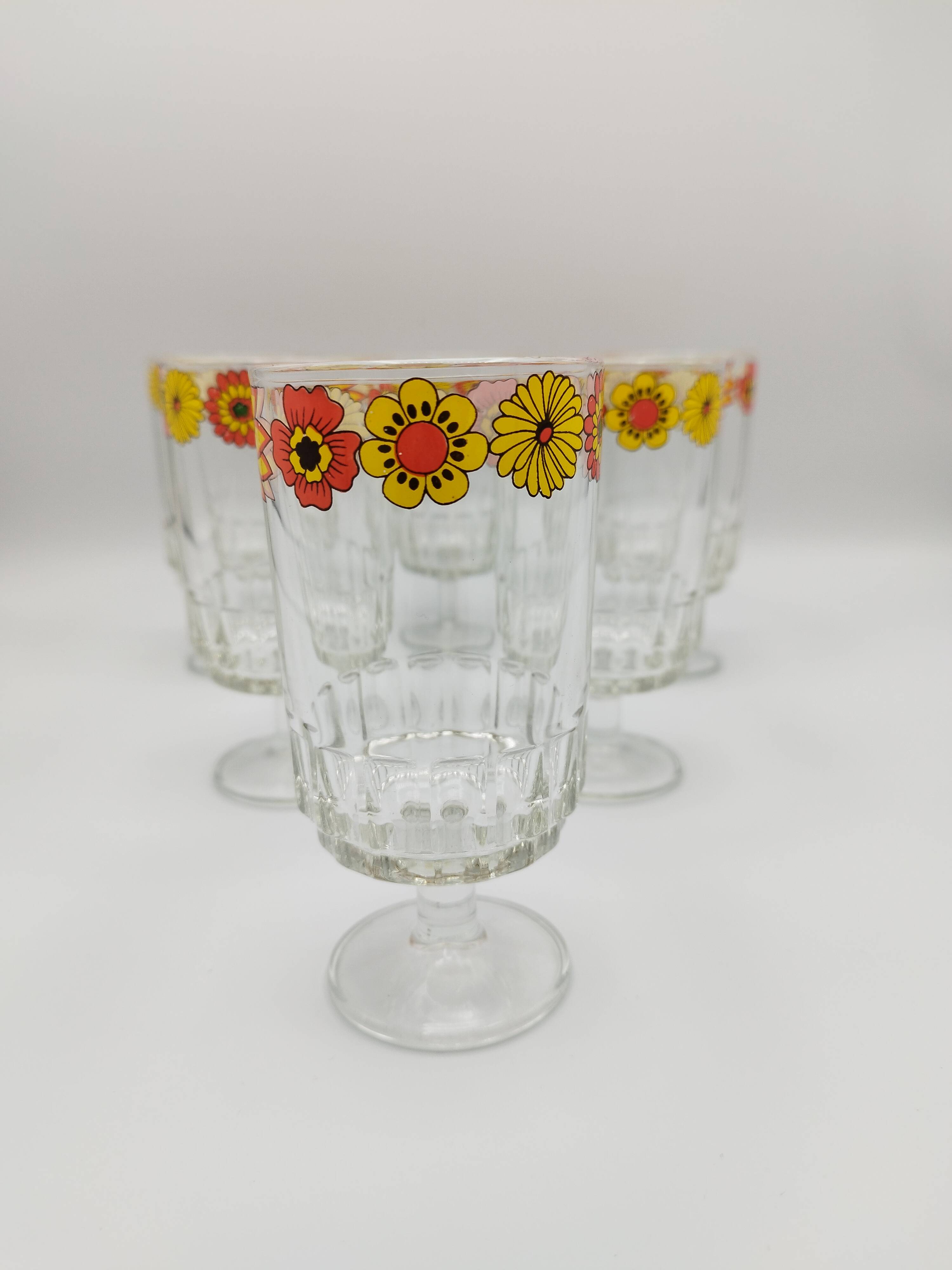 Vintage stemmed glass with floral decoration