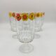 Vintage stemmed glass with floral decoration