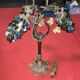 Decorative table lamp in the shape of coloured glass grape clusters.
