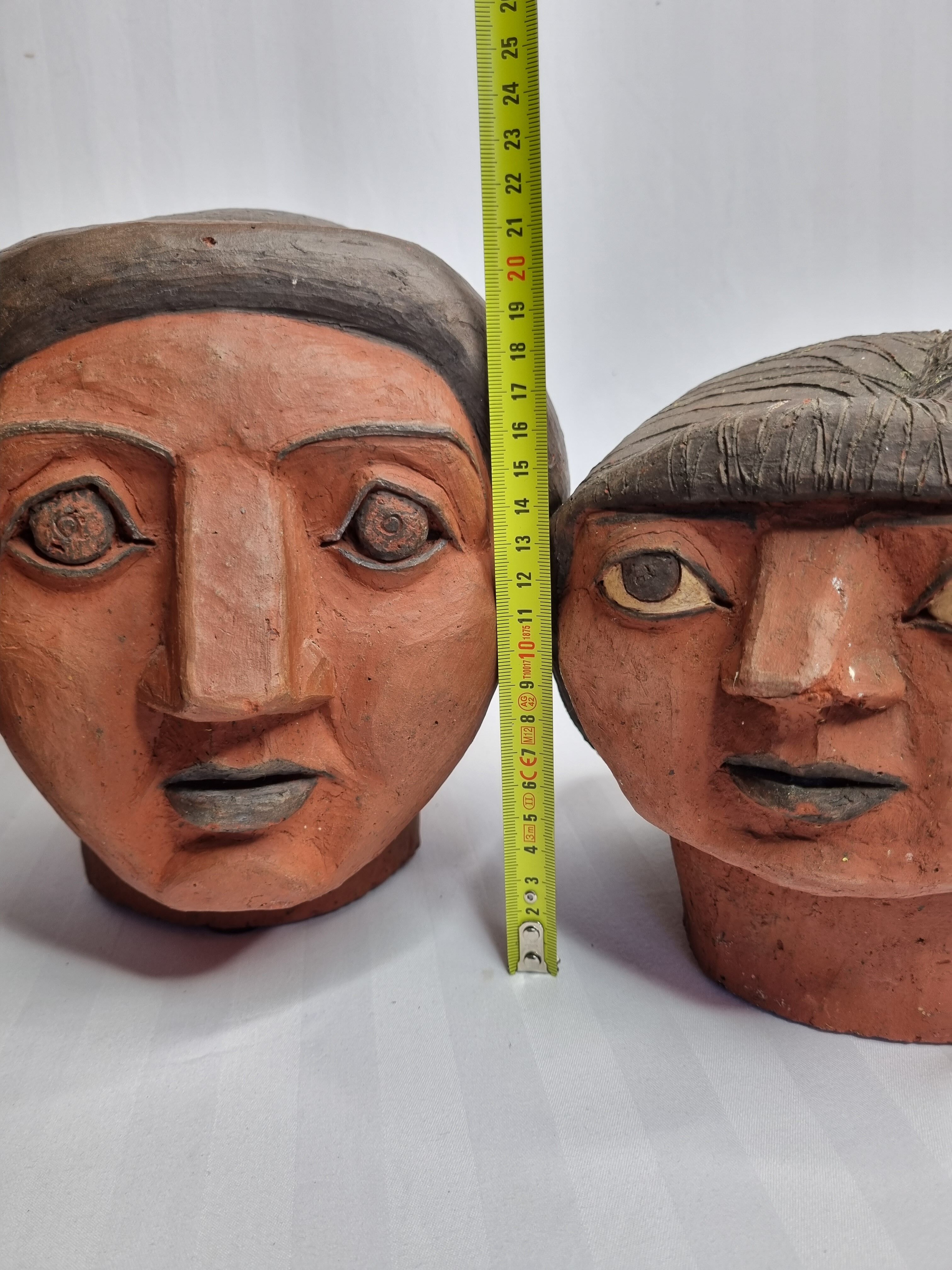 Set of 3 decorative women's heads in red terracotta