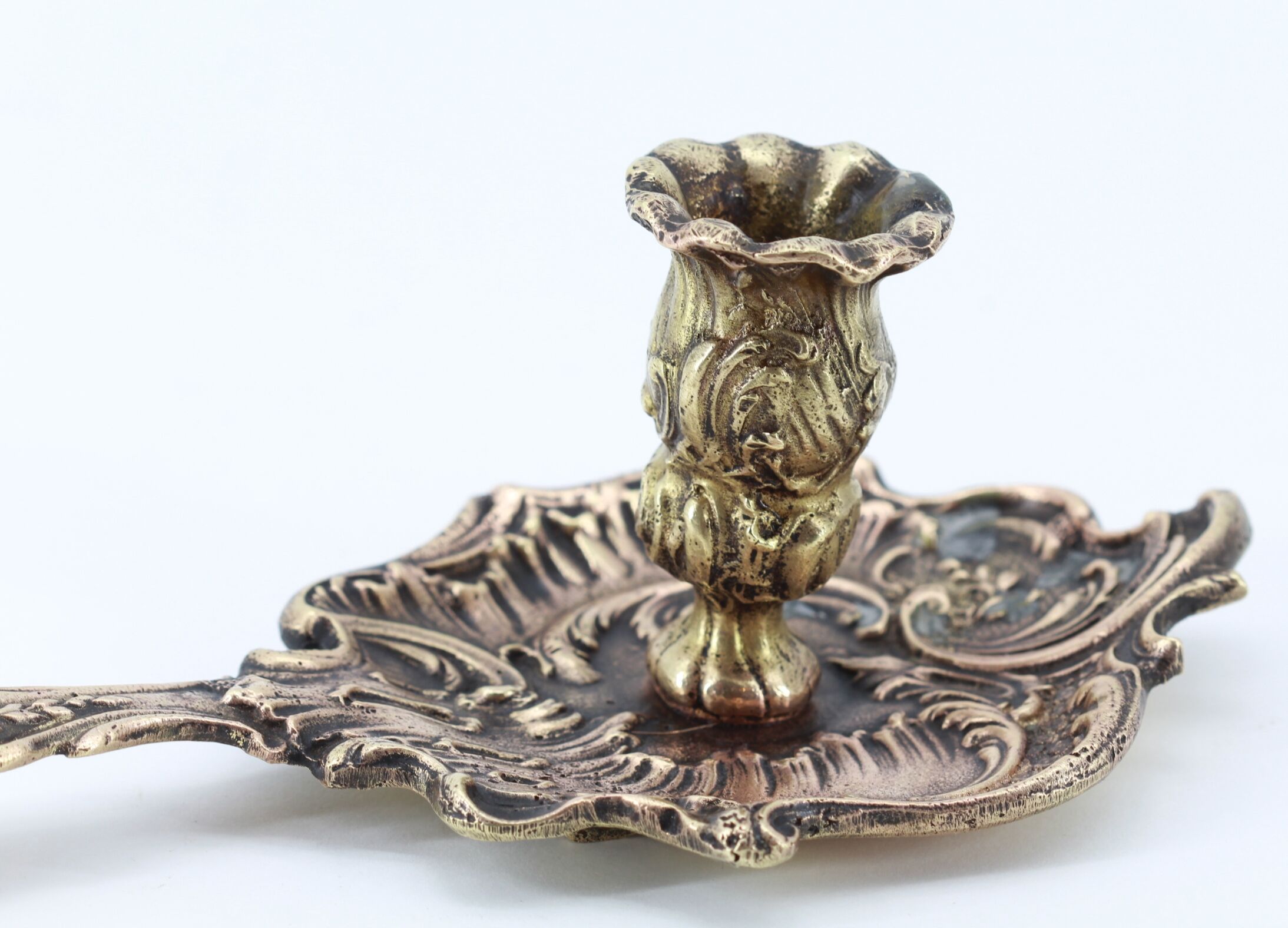 Old brass hand candle holder