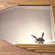 Antique Art Deco mercury mirror, in carved wood with gold leaf.