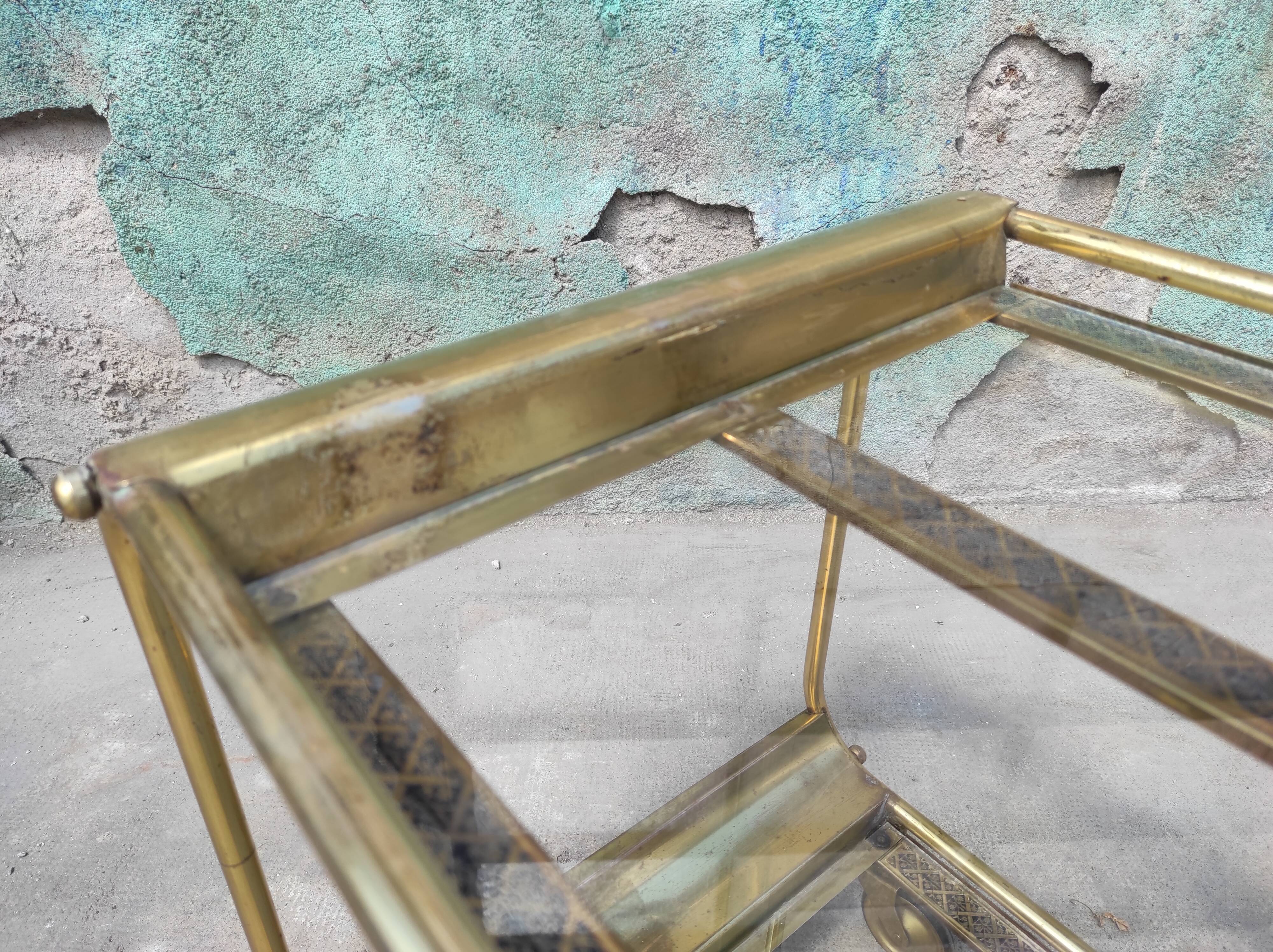 Old rolling coffee table serving vintage brass bar 50s mid-century design