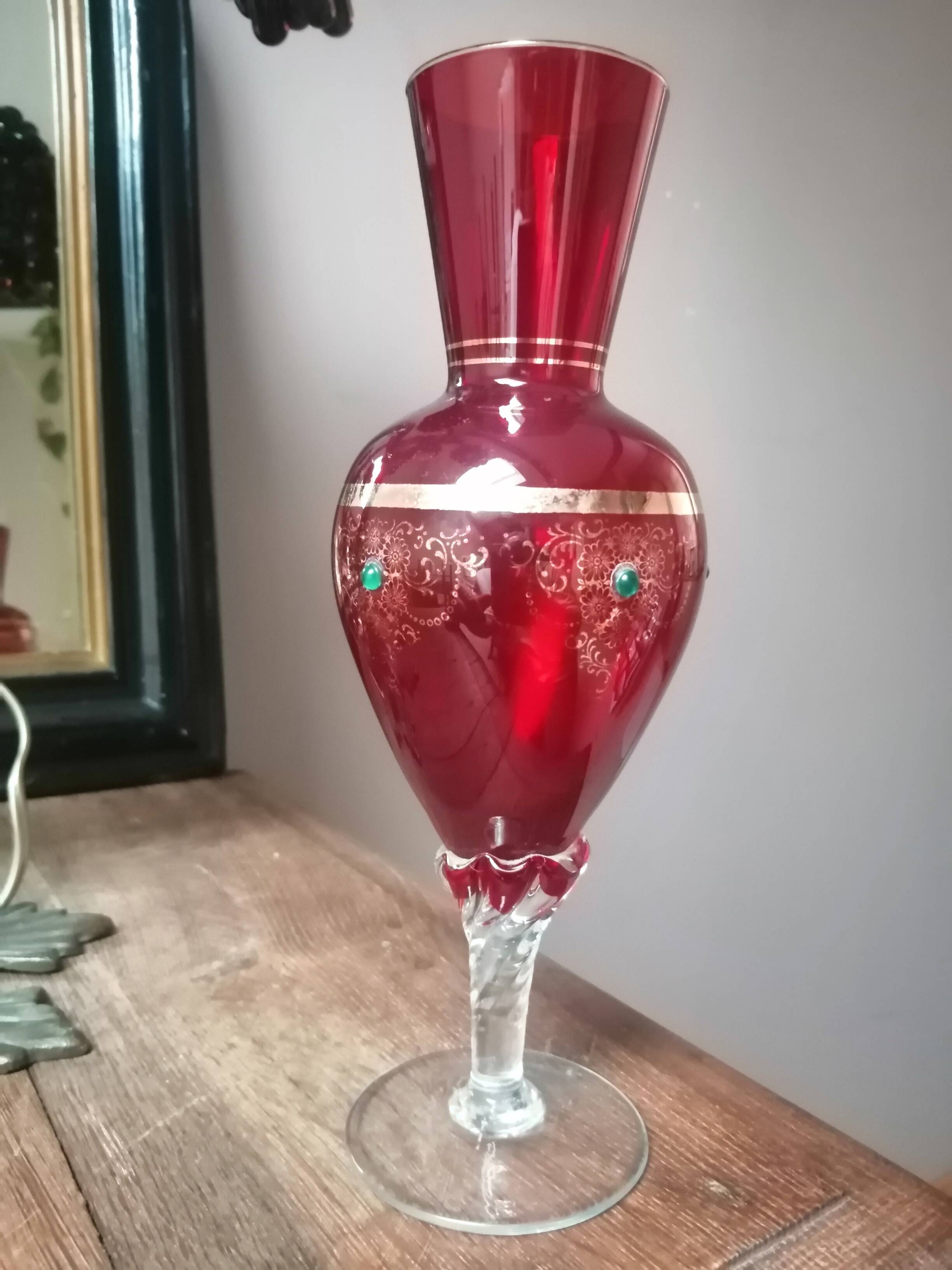Red vase with gold decoration