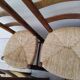 8 vintage straw chairs in the style of Charlotte Perriand.
