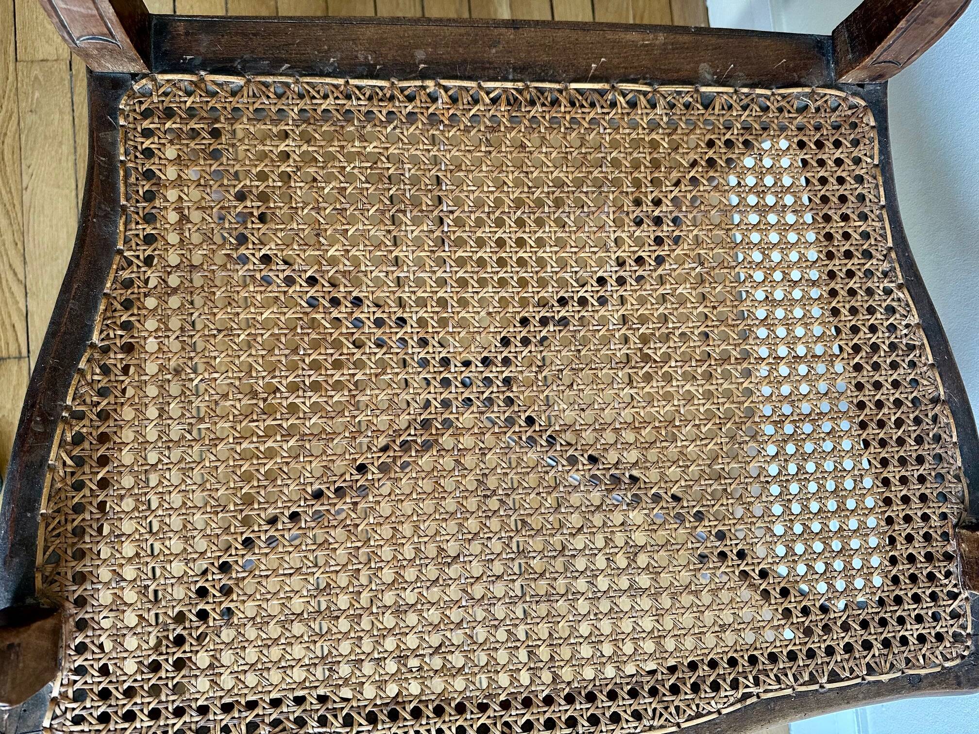 A pair of Regency armchairs with a stretcher.