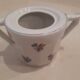Large milk jug and sugar bowl from the 1930s, decorated with a bouquet of flowers. Silver thread.