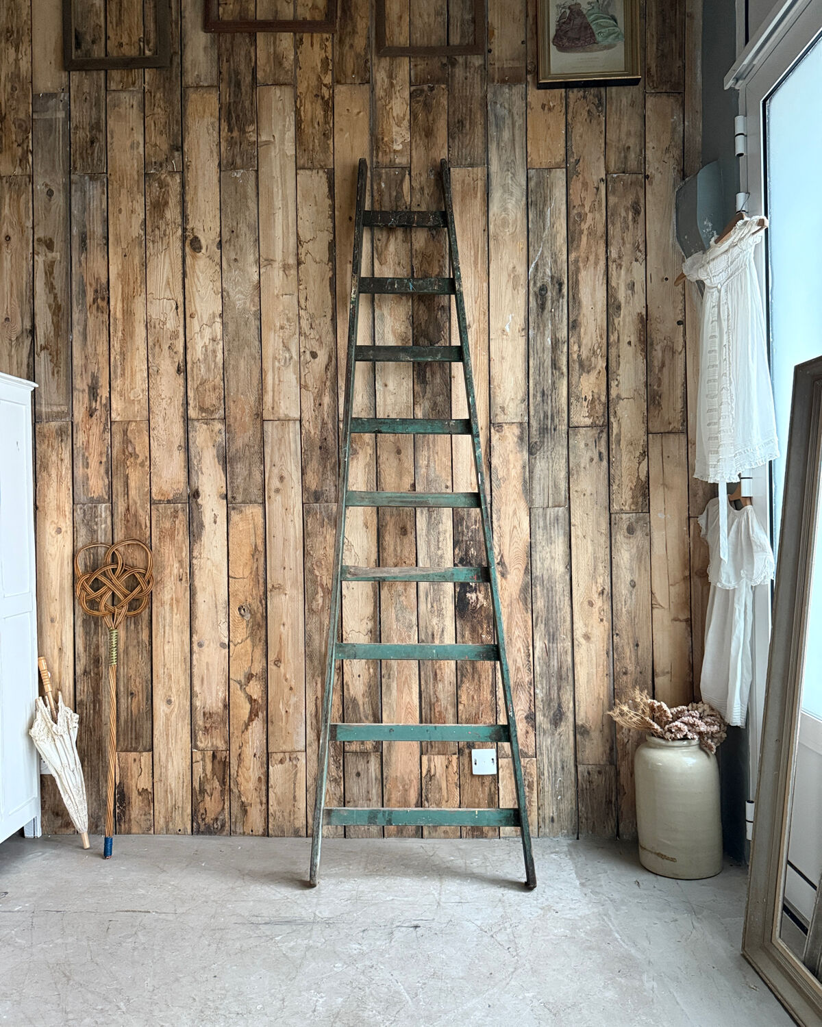 Antique ladder with green patina