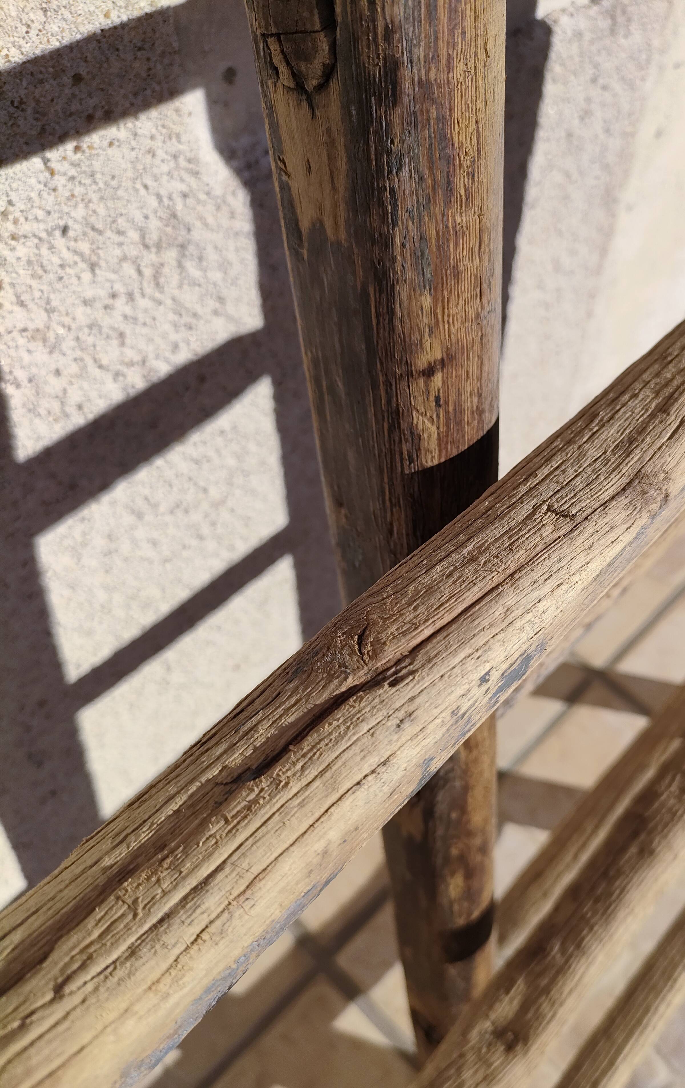 Two weathered wooden ladders H.135 cm