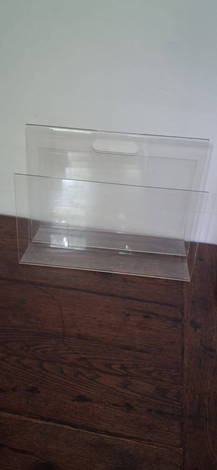 Vintage magazine rack in transparent plexiglass from the 1970s.