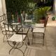 Table de terrasse plateau en verre + 6 chaises en fer forgé