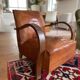 Vintage leather club chair with wooden armrests