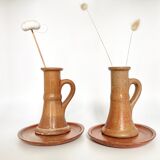 Pair of candlesticks and two sandstone cups