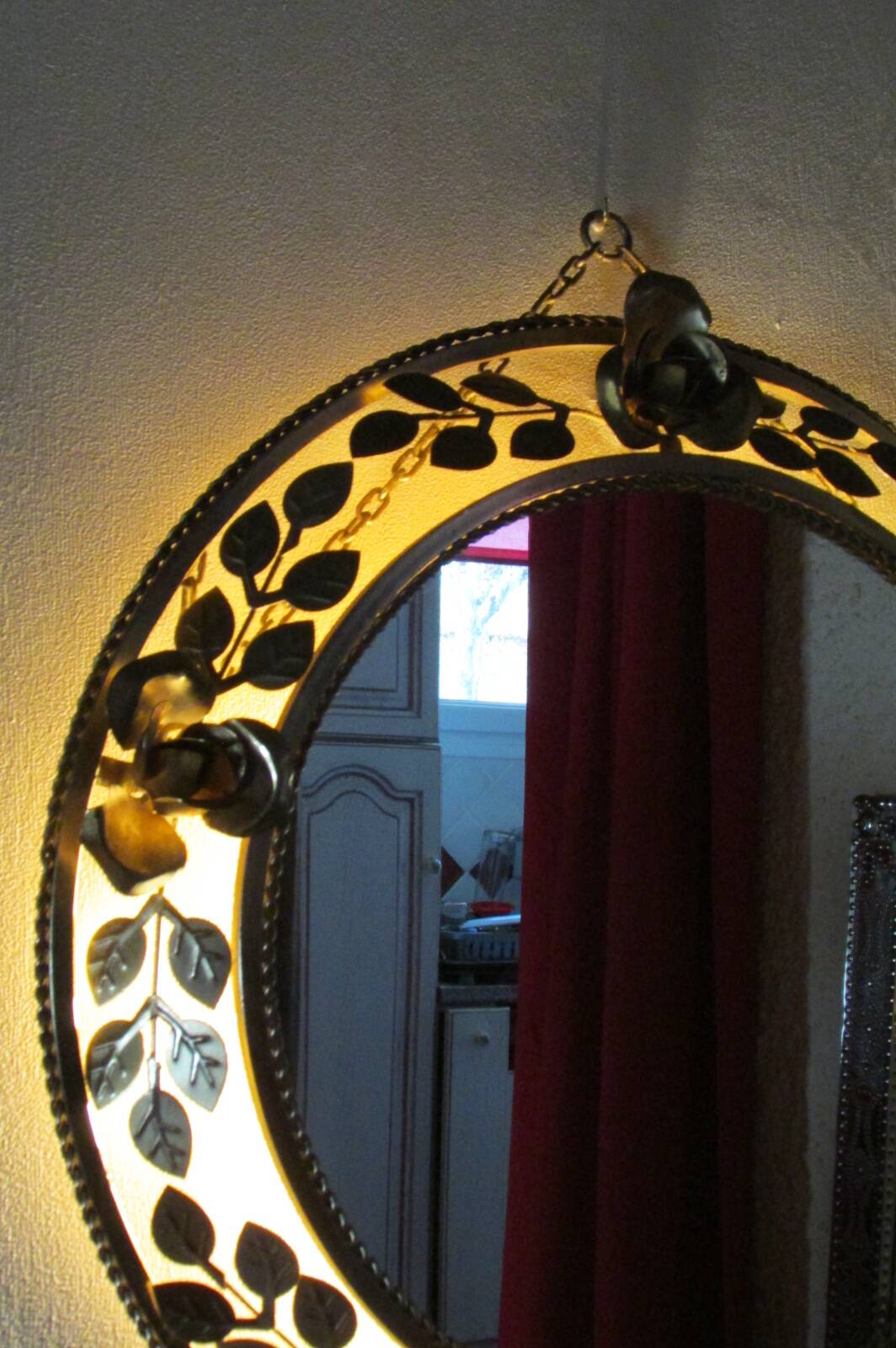 Round gold metal mirror, rose crown