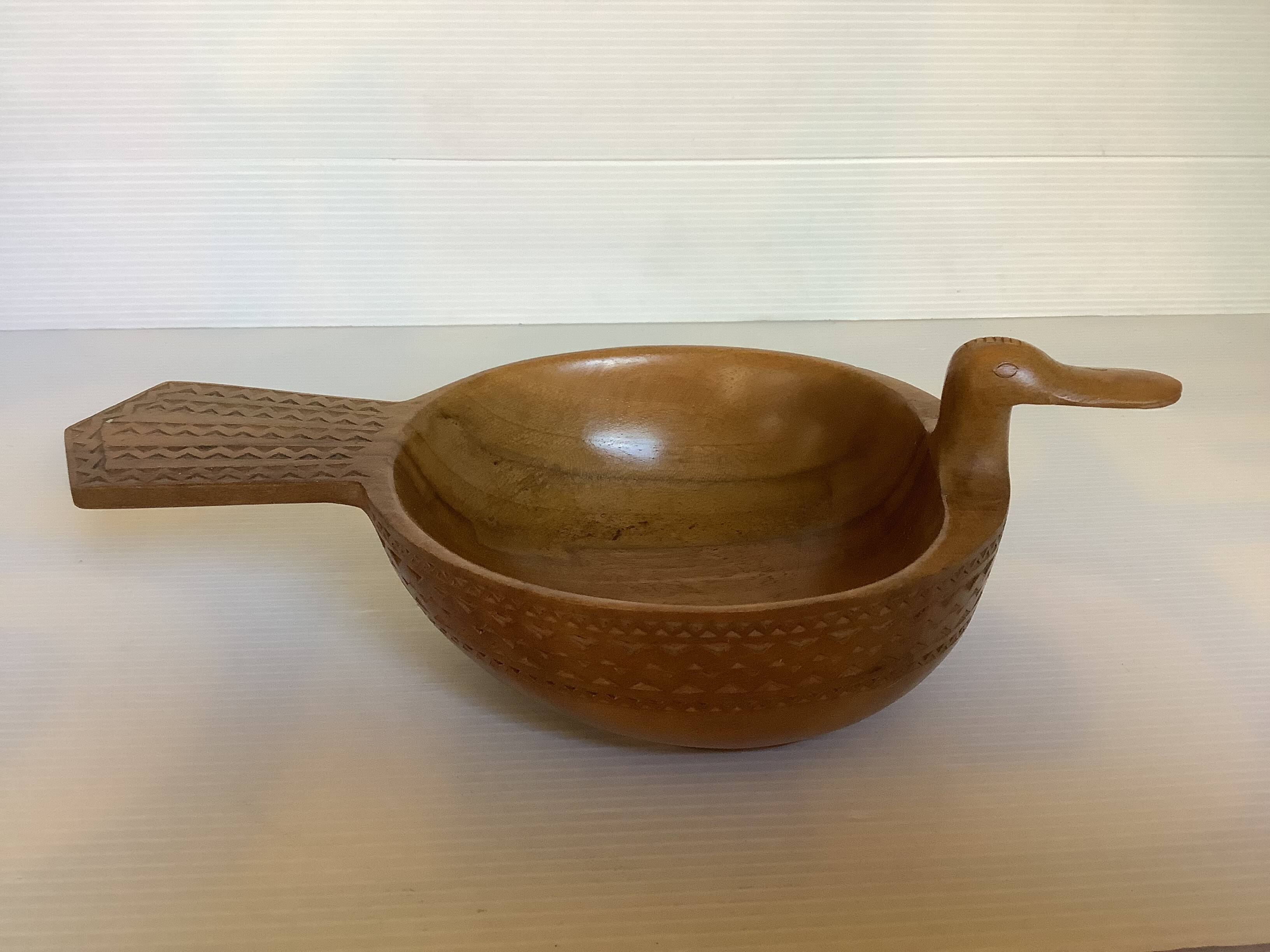 Carved wooden bird pocket