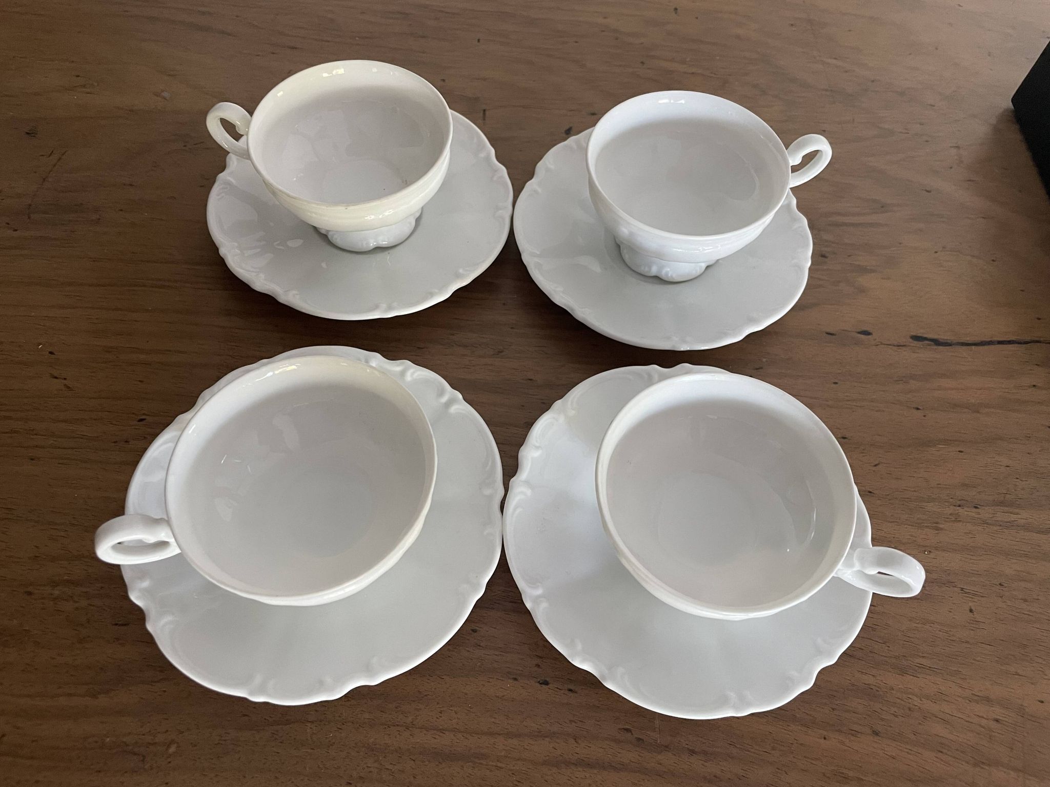 Set of 4 Hutschenreuther fine porcelain cups and saucers.