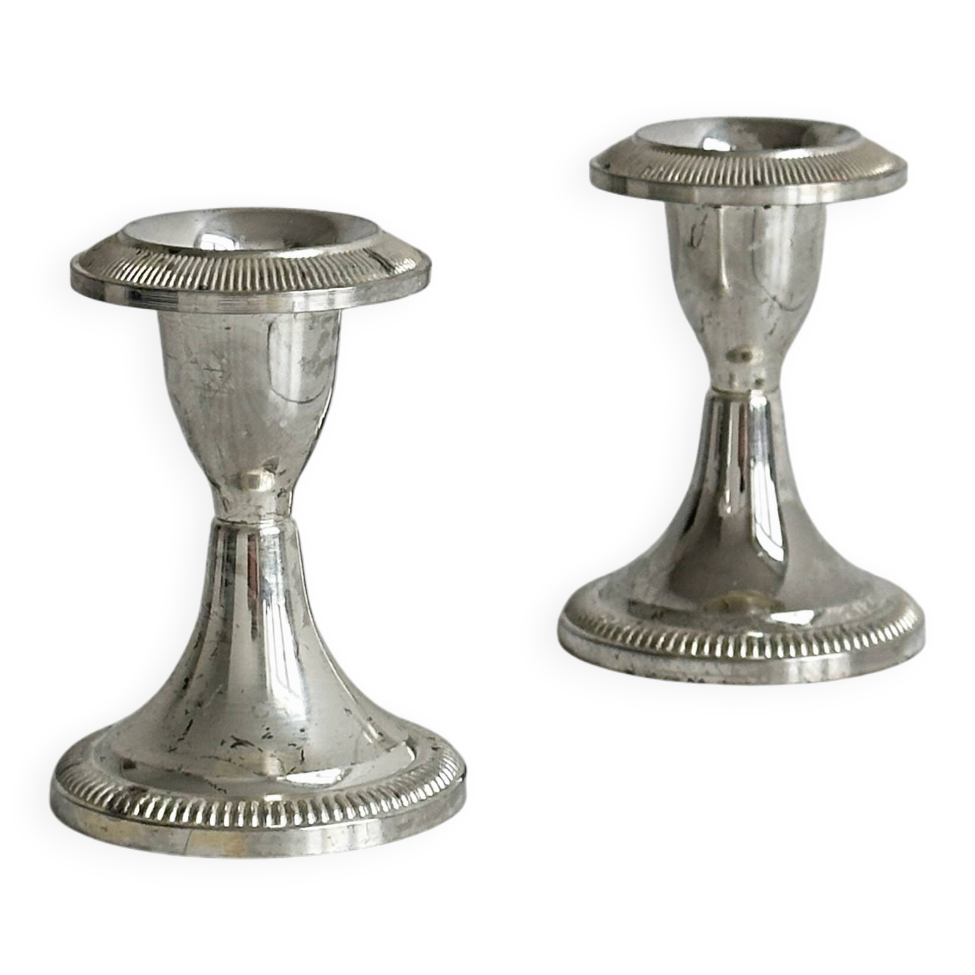 Set of 2 vintage silver-plated metal candle holders.