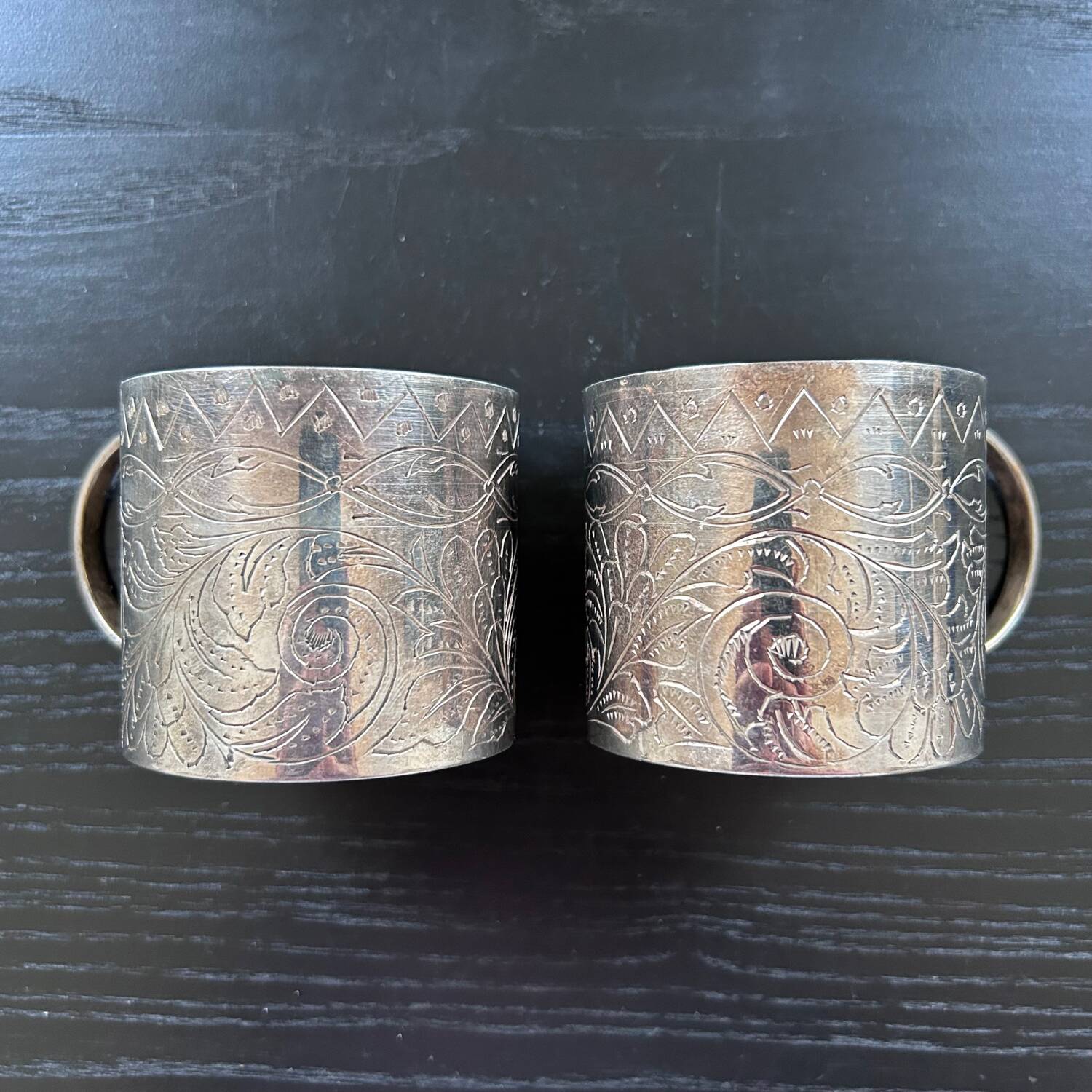 Pair of chiseled silver cups