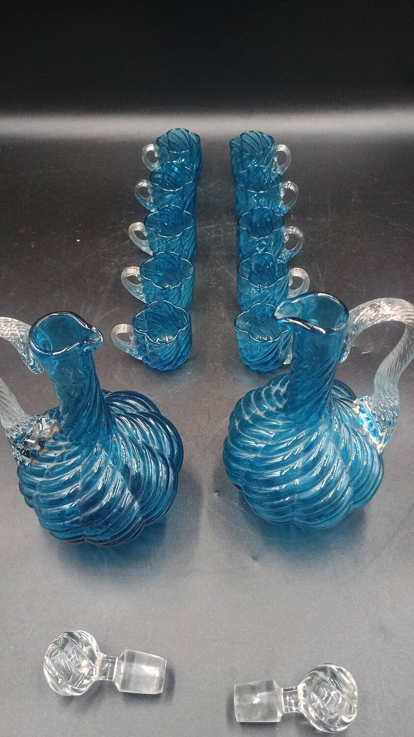 Cabaret Portieux liqueur service with 10 blue and clear glasses.