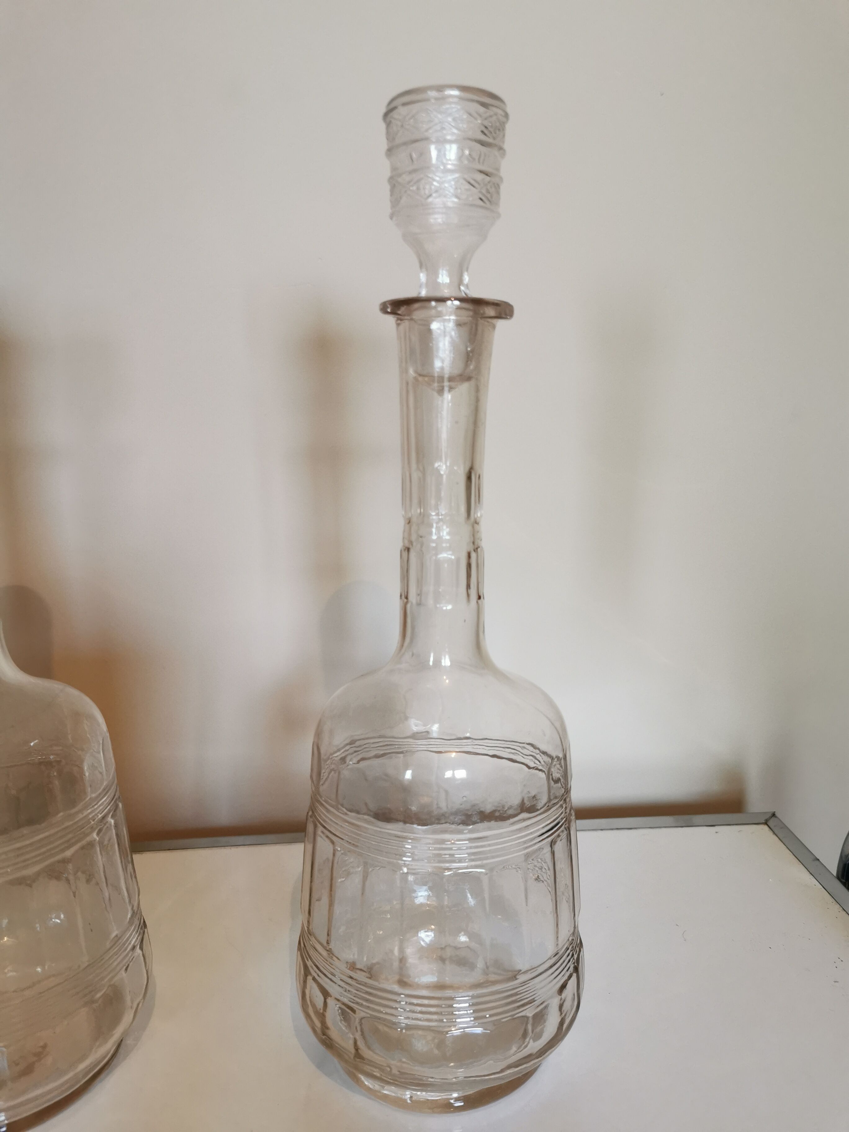 Pair of antique moulded glass decanters