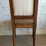 Solid oak art deco chair with cane and fabric.