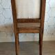 Solid oak art deco chair with cane and fabric.