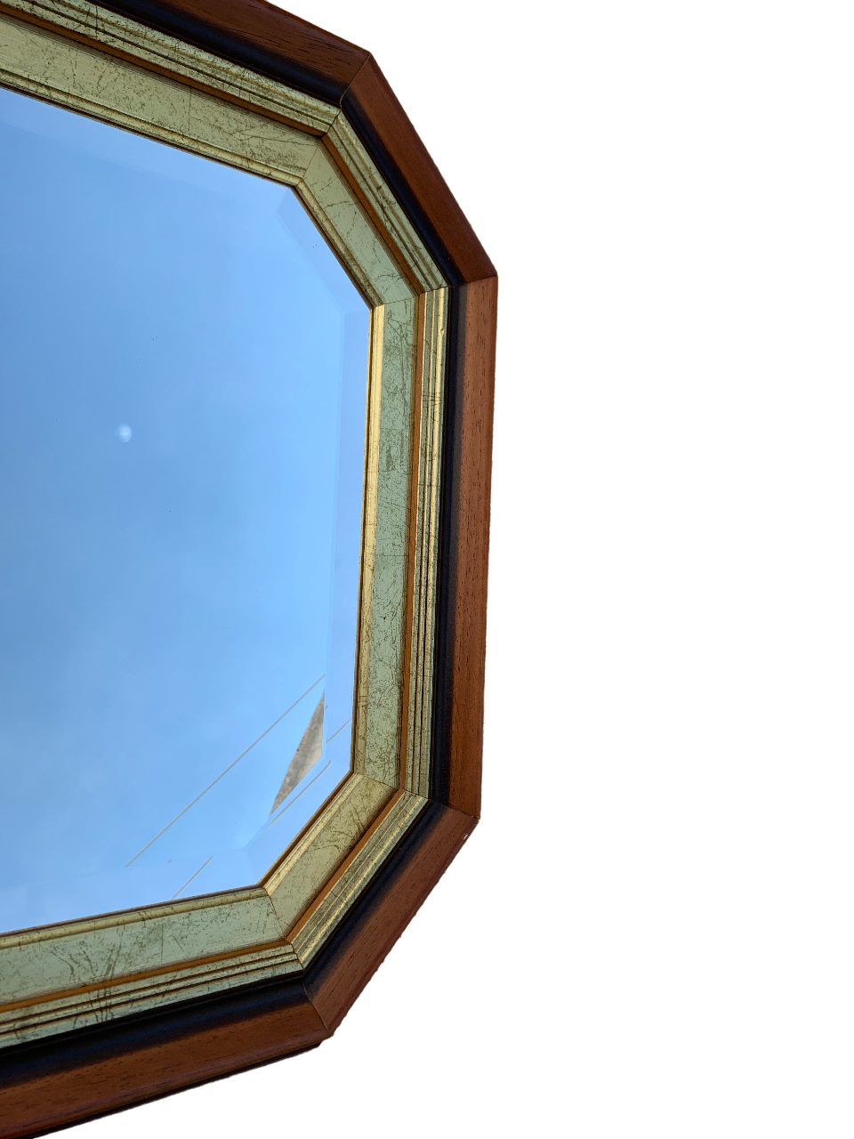 Beveled hexagonal mirror with cut wooden sides, gilded edging decoration