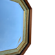 Beveled hexagonal mirror with cut wooden sides, gilded edging decoration