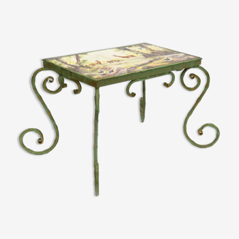 Wrought iron coffee table and polychrome ceramic tile top depicting animals