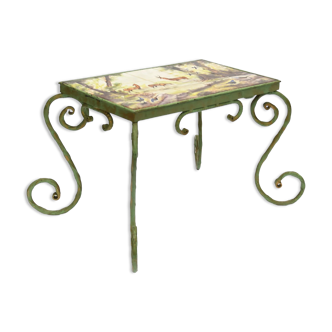 Wrought iron coffee table and polychrome ceramic tile top depicting animals