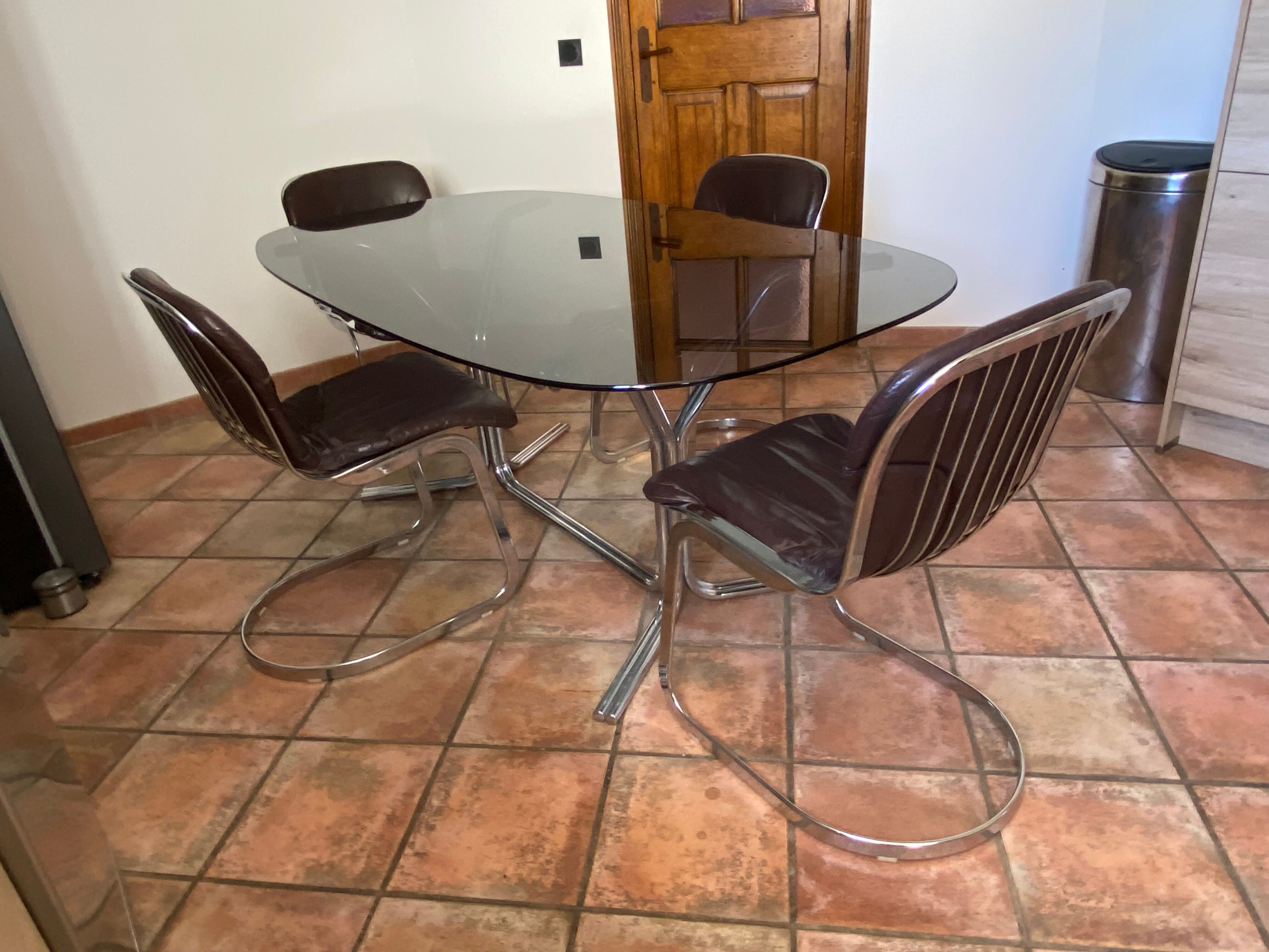 Oval table. 1970. Steel and smoked glass. 180x100