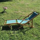 Vintage wooden and striped canvas deck chair – Retro style, chic country style