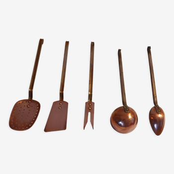 Old gilded brass and copper kitchen utensils