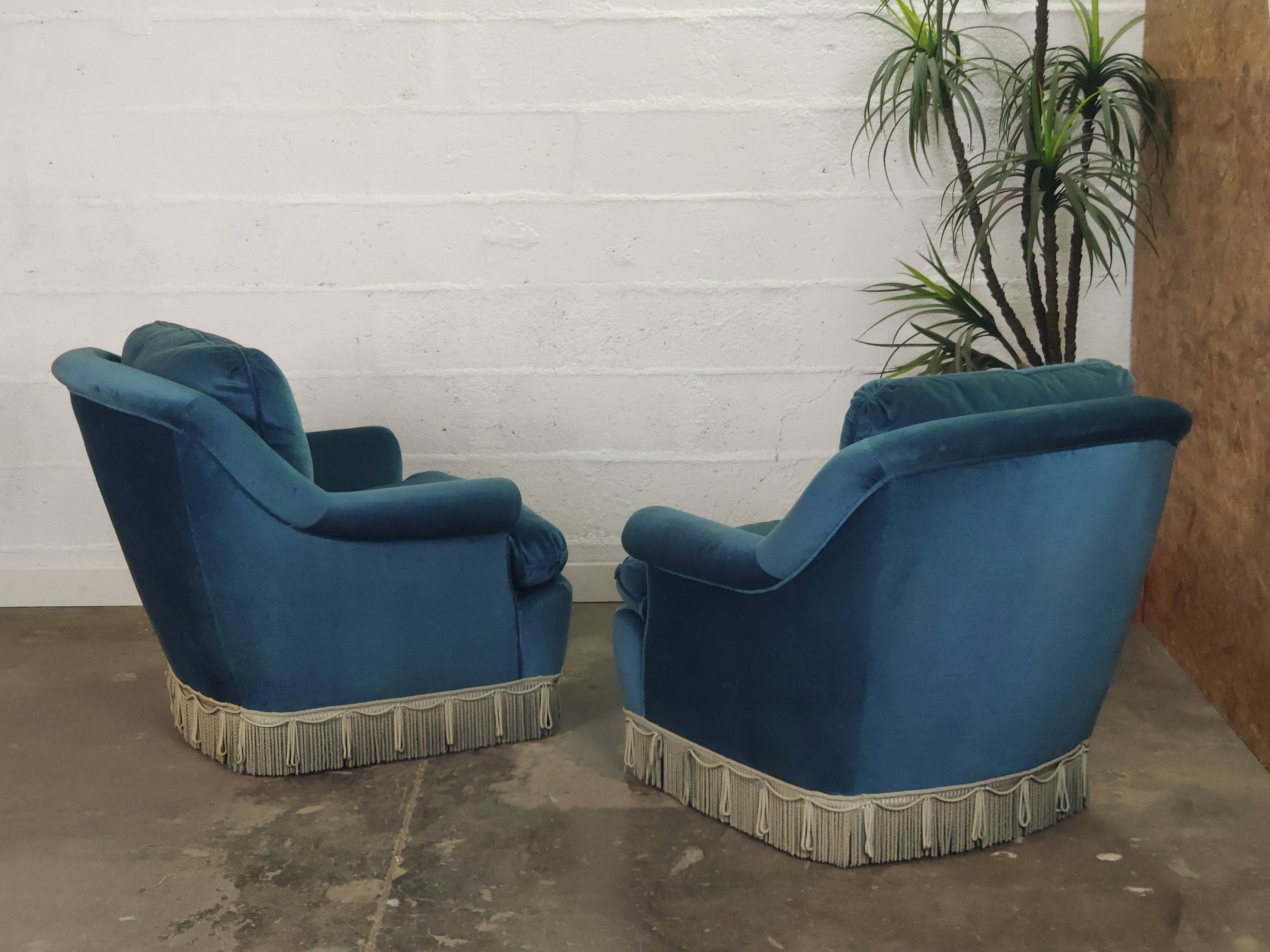 Pair of blue velvet armchairs with fringes