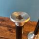 Trio of metal and wood candlesticks from the 80s
