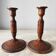 Pair of carved wooden candlesticks