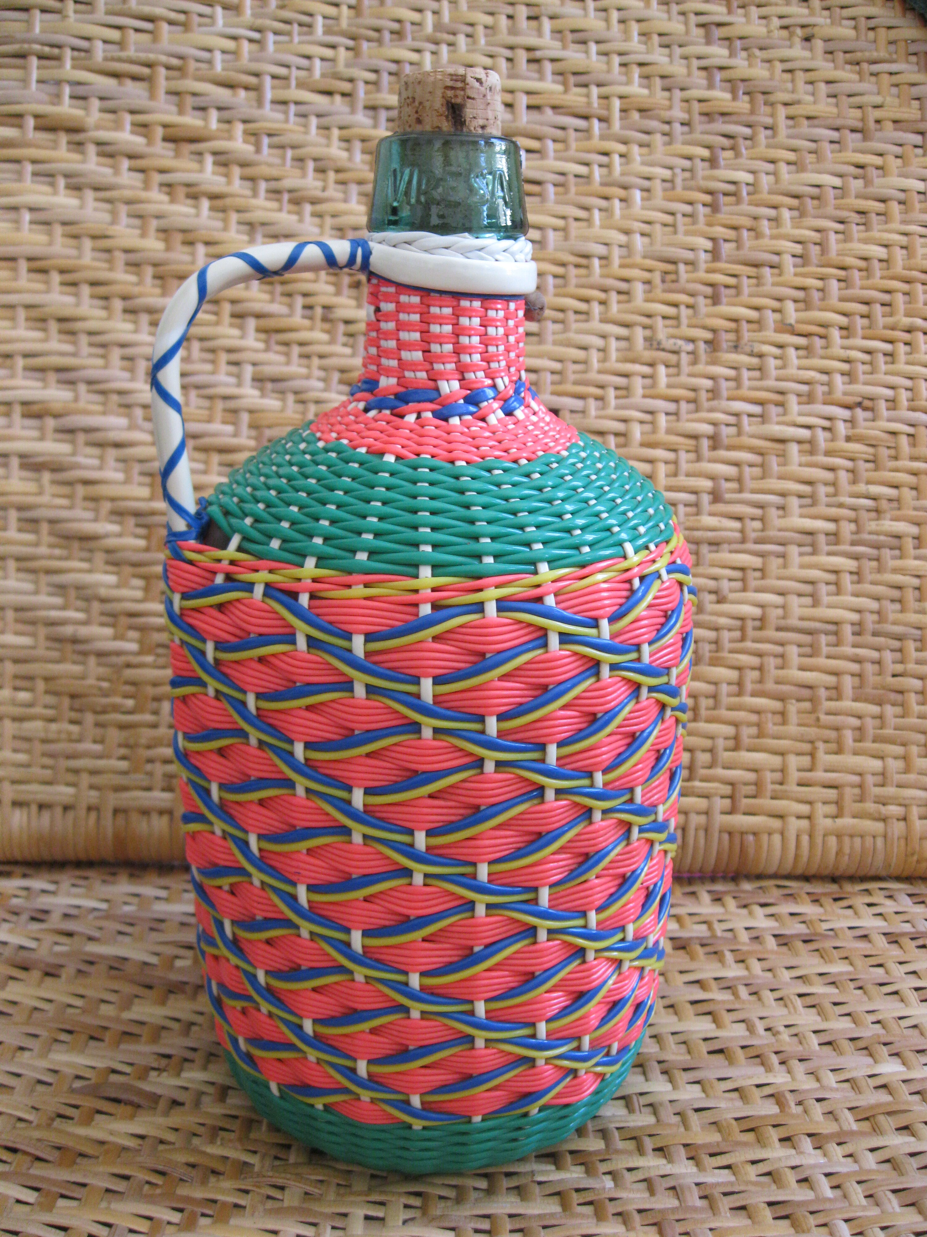 Vintage and multi-coloured demijohn