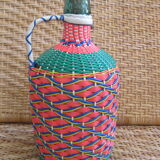 Vintage and multi-coloured demijohn