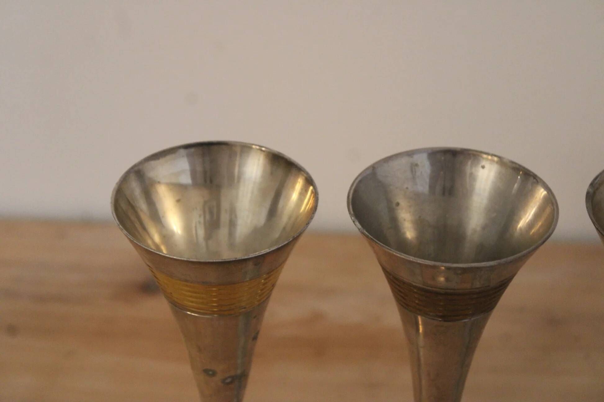Set of 3 vintage silver-plated and gold footed cups.