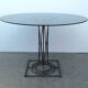 Table à manger en fer forgé avec son plateau en verre rond fumé, vintage 1980